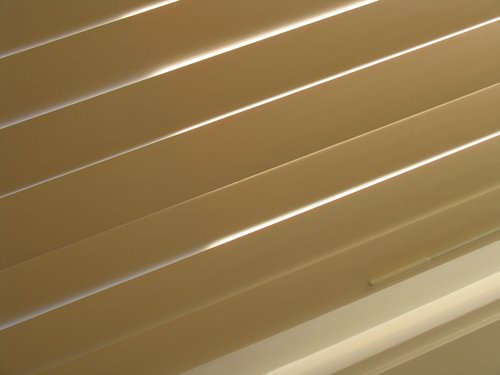 Morning sunlight (viewed through window blinds)