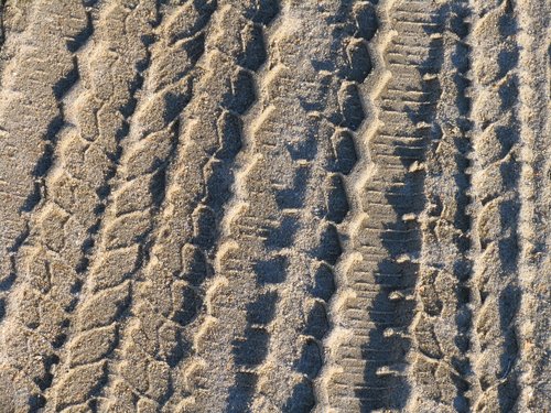 Tire Tracks in Dirty Sand (Detail)
