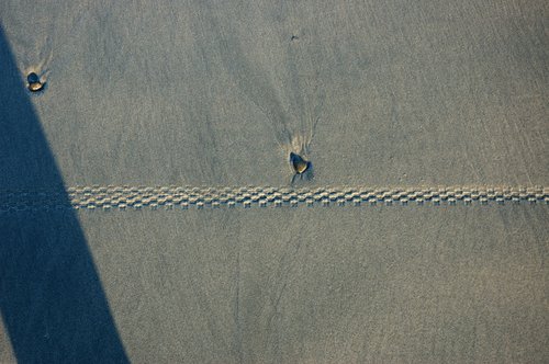 Bicycle track in wet sand