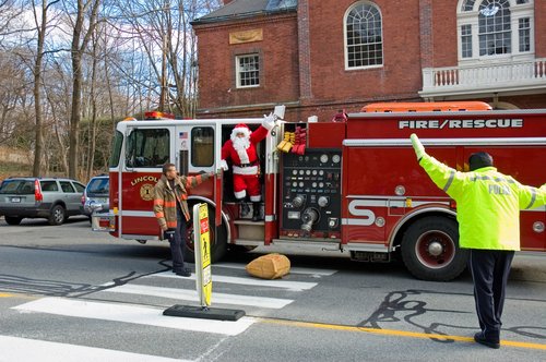 Santa (Jumping down from the truck)